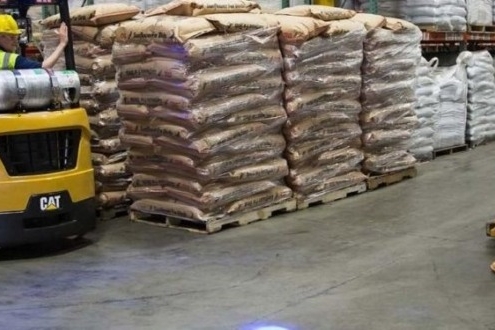 Workers using Forklifts for lifting goods in warehouse,OH