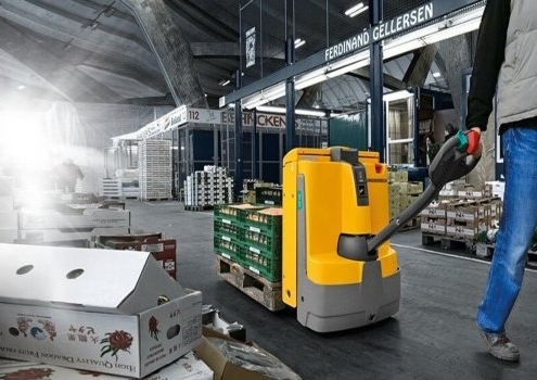 The man handling yellow color Electric pallet truck