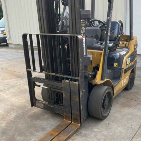 A CAT forklift is parked outside a warehouse in Dayton, OH.