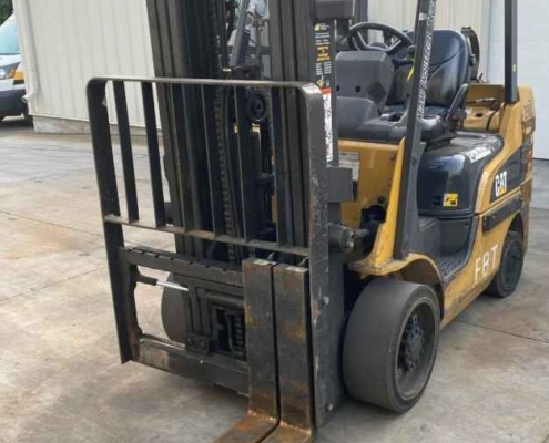 A CAT forklift is parked outside a warehouse in Dayton, OH.