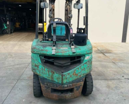 A green forklift with a large fork on the back is showcased at Miami Industrial Trucks in Dayton, OH.