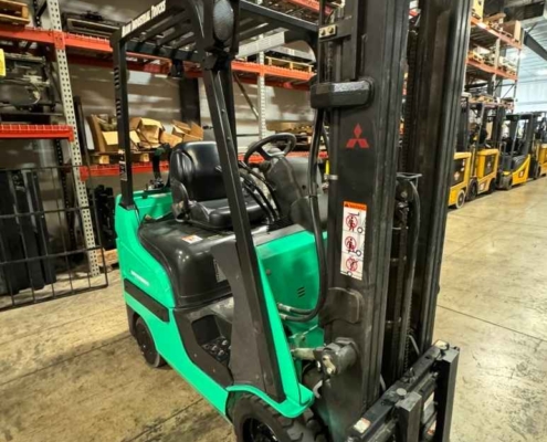 A Mitsu forklift is parked inside a warehouse in Dayton, OH.